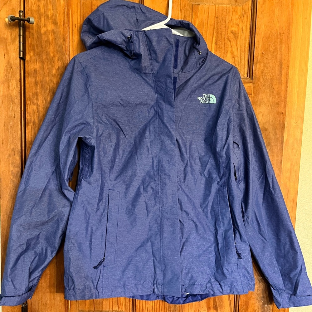 The North Face Blue Raincoat with Hood and Water-Resistant Material